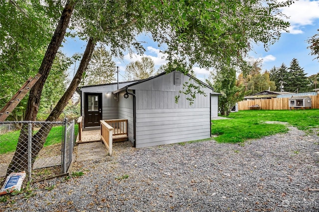 rear view of property with a yard