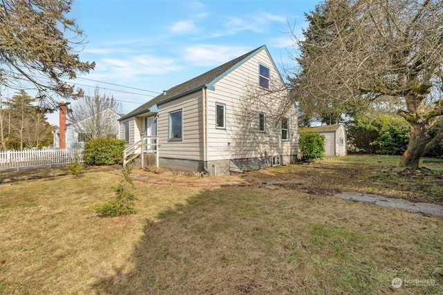 view of property exterior with a lawn and a storage unit