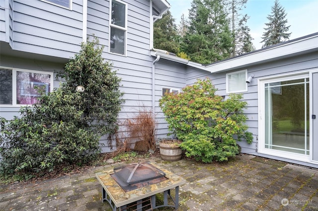 view of patio featuring an outdoor fire pit