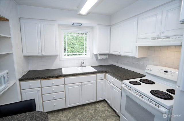 kitchen with tasteful backsplash, sink, white cabinets, and white range with electric cooktop