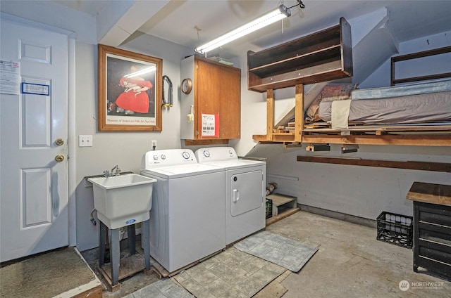 laundry area with independent washer and dryer and sink