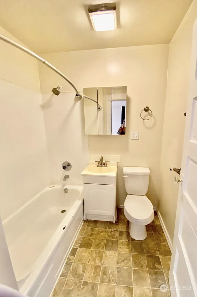 full bathroom featuring vanity, shower / tub combination, and toilet