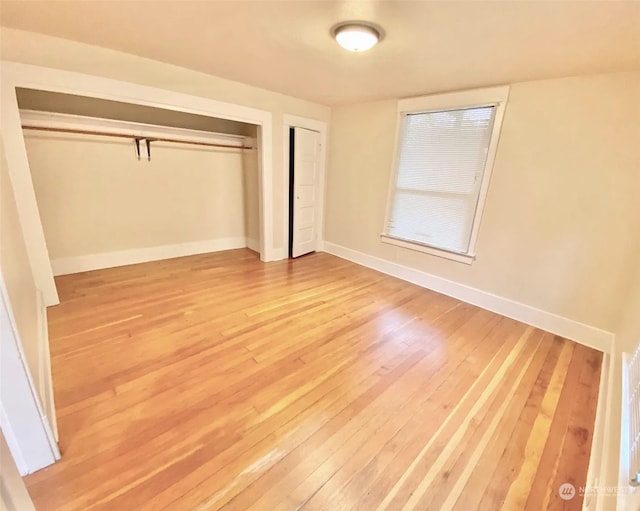 unfurnished bedroom with wood-type flooring