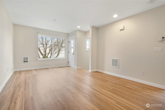 unfurnished living room with light hardwood / wood-style floors