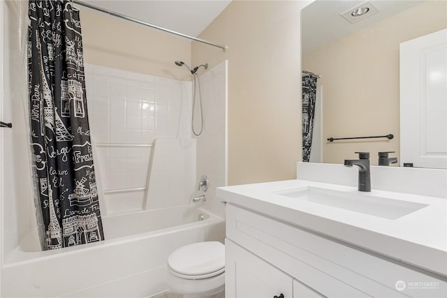 full bathroom featuring vanity, toilet, and shower / tub combo with curtain