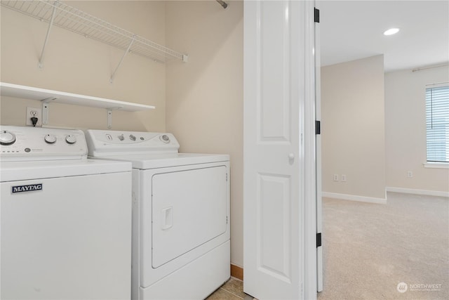 laundry room with light carpet and washer and clothes dryer