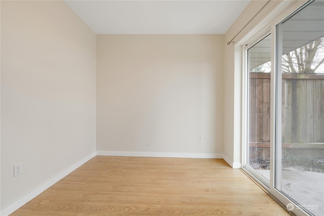 unfurnished room with light hardwood / wood-style flooring