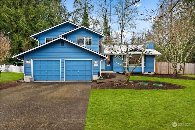 view of front of property with a garage and a front lawn