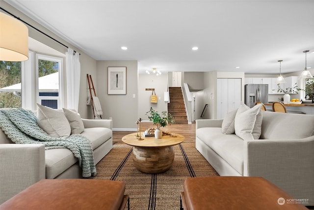 living room with hardwood / wood-style flooring and sink