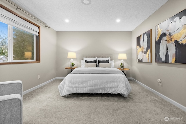 carpeted bedroom with a textured ceiling