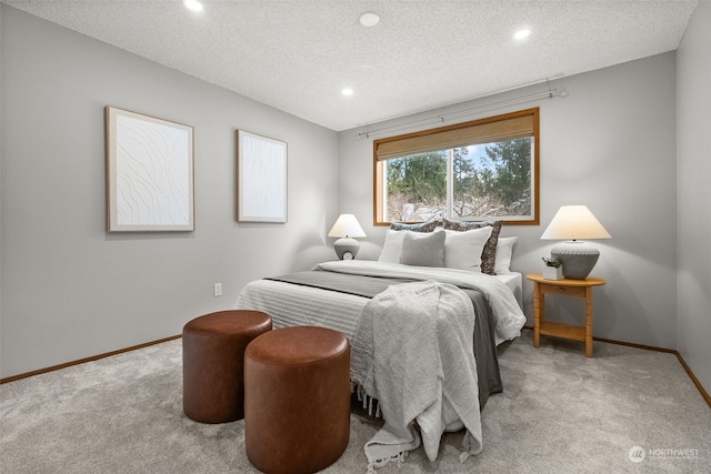 carpeted bedroom featuring a textured ceiling