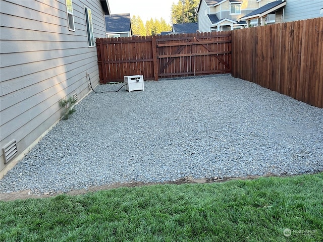 view of yard with a patio and a fenced backyard