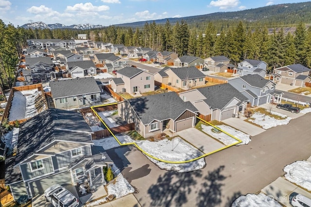 bird's eye view featuring a residential view and a wooded view