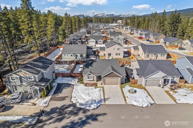 drone / aerial view with a residential view and a mountain view