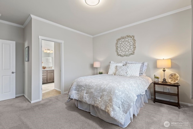 carpeted bedroom featuring baseboards, ensuite bathroom, and crown molding