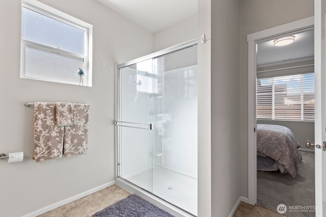 full bathroom with ensuite bath, a shower stall, and baseboards