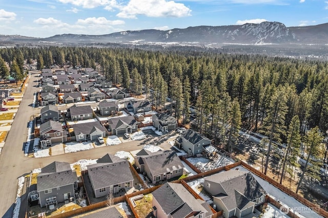 aerial view with a residential view, a wooded view, and a mountain view