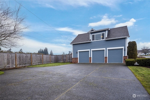 view of property exterior with a garage