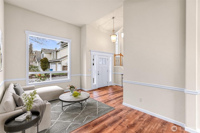 interior space featuring wood finished floors and baseboards