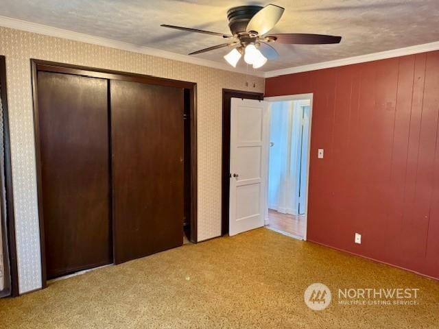 unfurnished bedroom with ceiling fan, ornamental molding, and light carpet