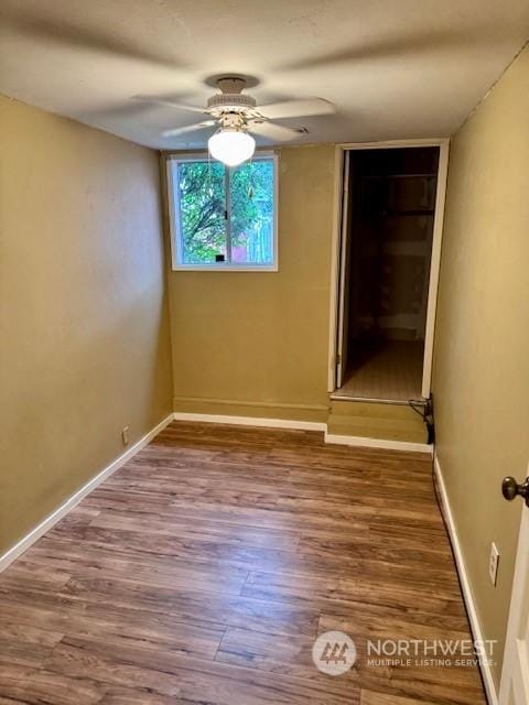 unfurnished room featuring ceiling fan and hardwood / wood-style floors