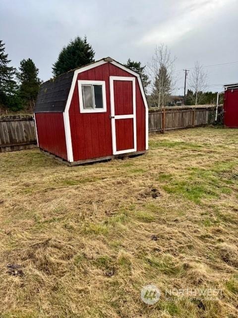 view of outbuilding featuring a yard