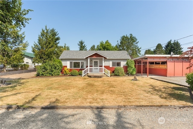 ranch-style home with a front lawn