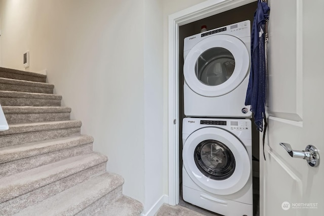 laundry room with stacked washer and clothes dryer