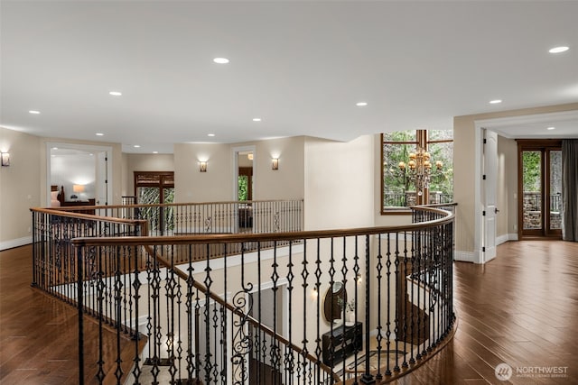 corridor featuring recessed lighting, an upstairs landing, and hardwood / wood-style flooring