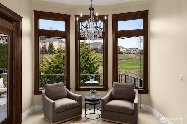 interior space featuring an inviting chandelier and baseboards