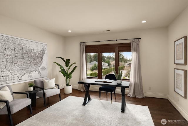 office space featuring dark wood-style flooring, recessed lighting, visible vents, and baseboards