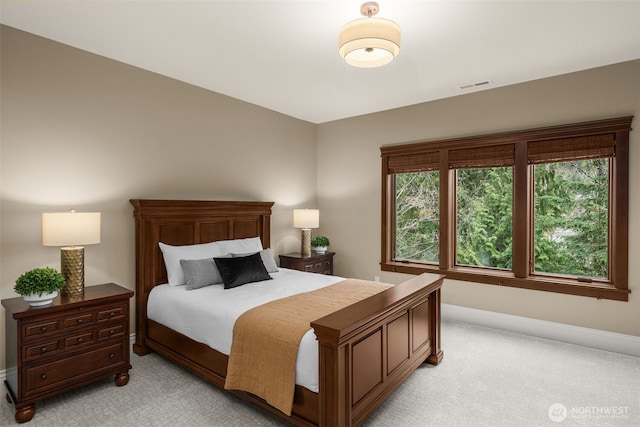 bedroom with light carpet, baseboards, and visible vents