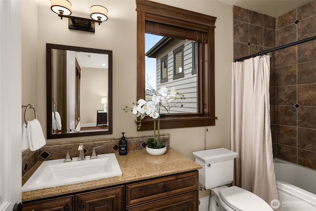 full bathroom with toilet, tasteful backsplash, vanity, and shower / tub combo with curtain