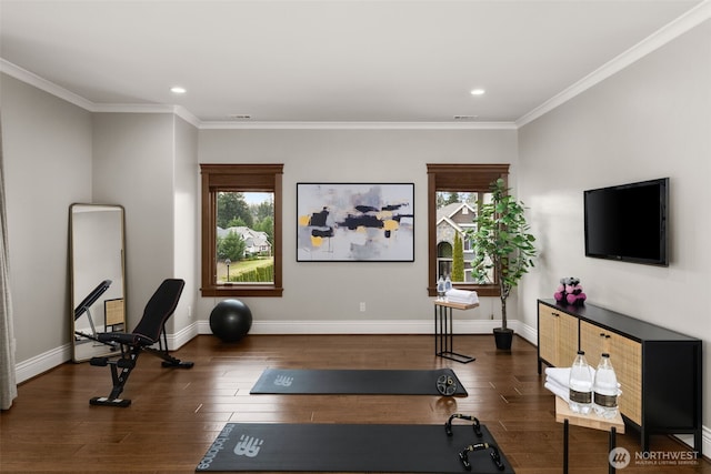 exercise room with recessed lighting, visible vents, ornamental molding, wood finished floors, and baseboards