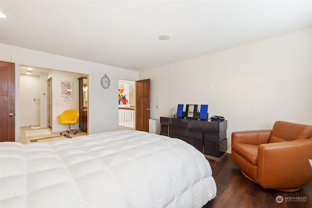 bedroom with hardwood / wood-style flooring