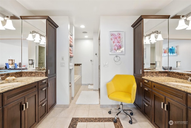 bathroom featuring tile patterned flooring and vanity