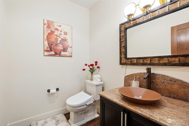 bathroom with vanity and toilet