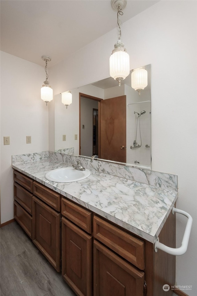 bathroom with vanity and hardwood / wood-style floors