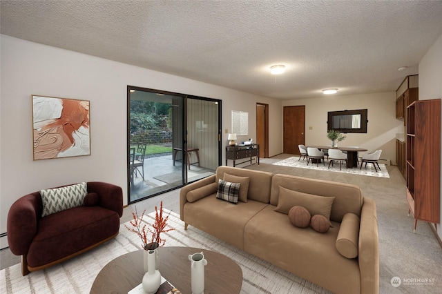 living room with light carpet and a textured ceiling