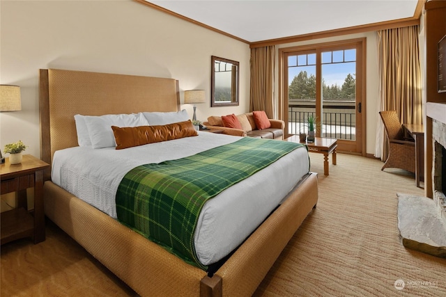 bedroom with light colored carpet, ornamental molding, a fireplace, and access to outside