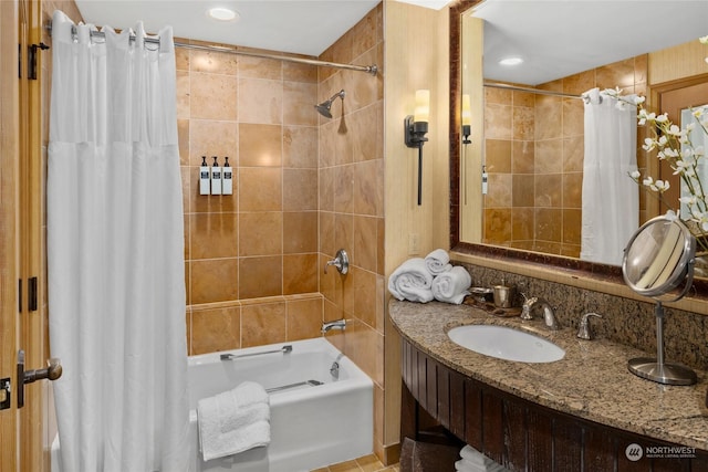 bathroom with sink and shower / bath combo with shower curtain