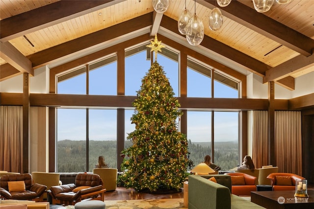 living room featuring beamed ceiling, wood ceiling, and plenty of natural light