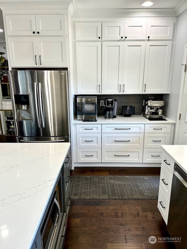 kitchen with white cabinetry and appliances with stainless steel finishes