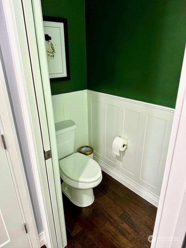 bathroom featuring hardwood / wood-style flooring and toilet