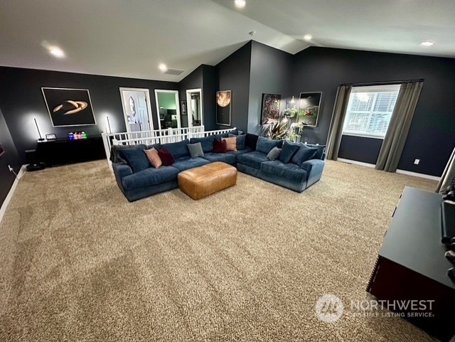 carpeted cinema with vaulted ceiling