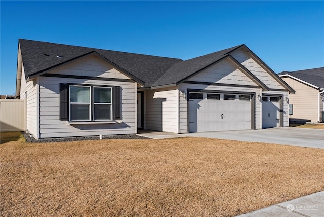 view of front of home with a garage and a front yard