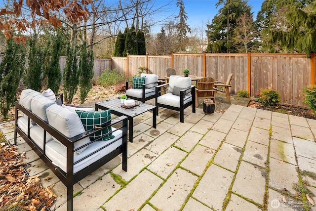 view of patio with a fenced backyard and an outdoor living space