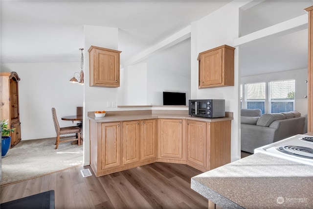 kitchen featuring a notable chandelier, decorative light fixtures, dark hardwood / wood-style flooring, and light brown cabinets