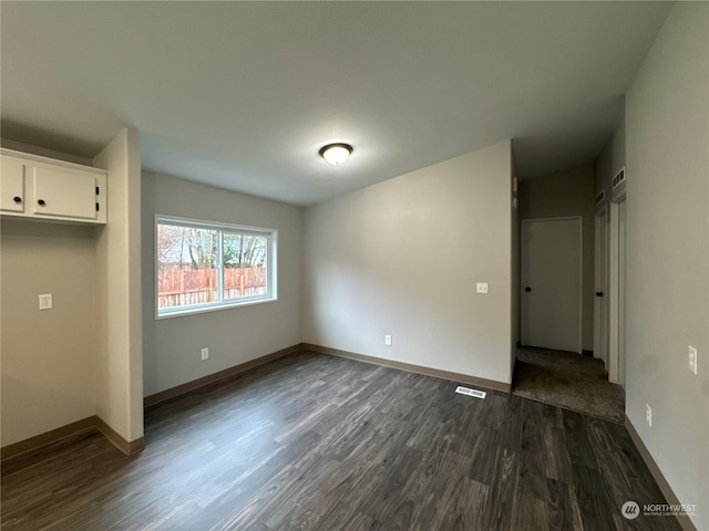 interior space with dark hardwood / wood-style floors