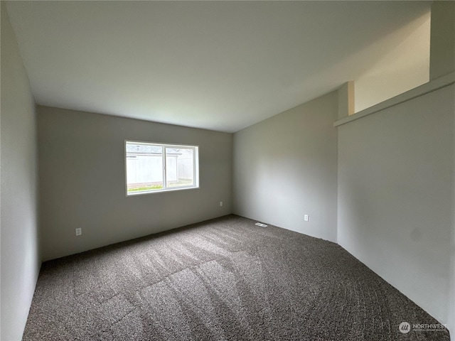 spare room featuring carpet flooring